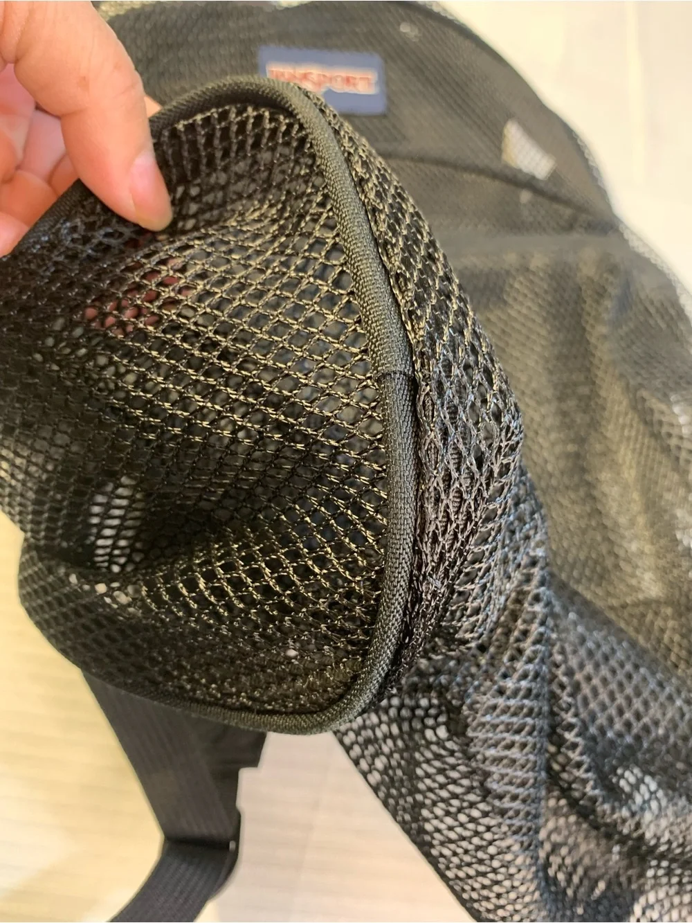 JanSport Mesh Pack Backpack in Black, a semi-trans. EC style TB500315